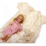 AN ARMAND MARSEILLE GERMAN BISQUE HEADED DOLL number 390, 30cm in length