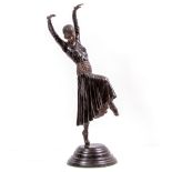 A BRONZE ART DECO STYLE DANCING LADY 61cm in height