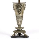 A CONTINENTAL CAST SPELTER TABLE LAMP decorated with classical masks to the tapering body with