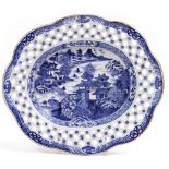 AN ANTIQUE CHINESE BLUE AND WHITE PORCELAIN DISH with a shaped and pierced edge, 22cm wide