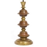 A CONTINENTAL POSSIBLY ITALIAN COPPER AND BRASS TURNED BOBBIN TABLE LAMP with spreading base,