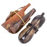TWO OLD LEATHER GUN CASES together with an African decorative mask, topper log holder and a set of