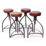 A SET OF FOUR ADJUSTABLE BAR STOOLS with brown leather upholstered seats and steel frames, each 45cm