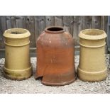 A TERRACOTTA RHUBARB FORCER 40cm wide x 51cm high (cracked) and two small chimney pots each 46cm