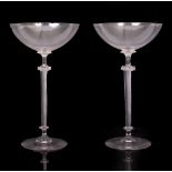 A PAIR OF COCKTAIL GLASSES with spiral air twist stems, on circular spreading bases, 23cm high
