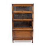 AN OAK GLOBE WERNICKE FOUR SECTION BOOKCASE the stand with square legs, 86.5cm wide x 162.5cm high