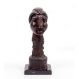 A BRONZE FIGURE OF ABSTRACT HEAD AND SHOULDER FORM on a black marble base, 18cm wide x 44cm high