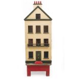 A VINTAGE PAINTED DOLL'S HOUSE 167cm high overall including base x 59cm wide x 43cm deep on stand