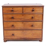 A VICTORIAN MAHOGANY TWO SHORT OVER THREE LONG DRAWER CHEST with turned wooden handles and bun feet,