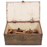 A VINTAGE PAINTED TOOL BOX with contents therein to include a handsaw, hammers and various other