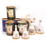 A COLLECTION OF BELLS WHISKEY DECANTERS to include boxed and cased examples, predominately by