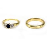 AN 18 CARAT YELLOW GOLD WEDDING BAND and an 18th carat yellow gold sapphire and diamond three