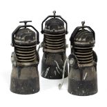 THREE VINTAGE INDUSTRIAL LIGHT FITTINGS reputedly originally from The Ark Royal, 52cm high