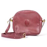 A MUST DE CARTIER BURGUNDY LEATHER SMALL HANDBAG with a single shoulder strap and gold zip with a