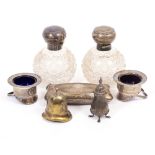 A PAIR OF SILVER MOUNTED PERFUME AND SCENT BOTTLES a condiment set and stand in the form of a