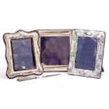 THREE CONTEMPORARY SILVER PHOTO FRAMES and one silver handled letter opener (4)