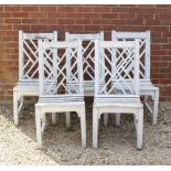 A WHITE PAINTED TEAK GARDEN TABLE AND FIVE CHAIRS by Andrew Grace Designs, the table 164cm wide x