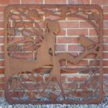 A PIERCED STEEL DECORATIVE WALL PANEL depicting a fairy and a bird perched on a branch, 96.5cm