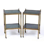 A PAIR OF BRASS TWO TIER TABLES each with tooled green leather inserts and on brass casters, 33cm