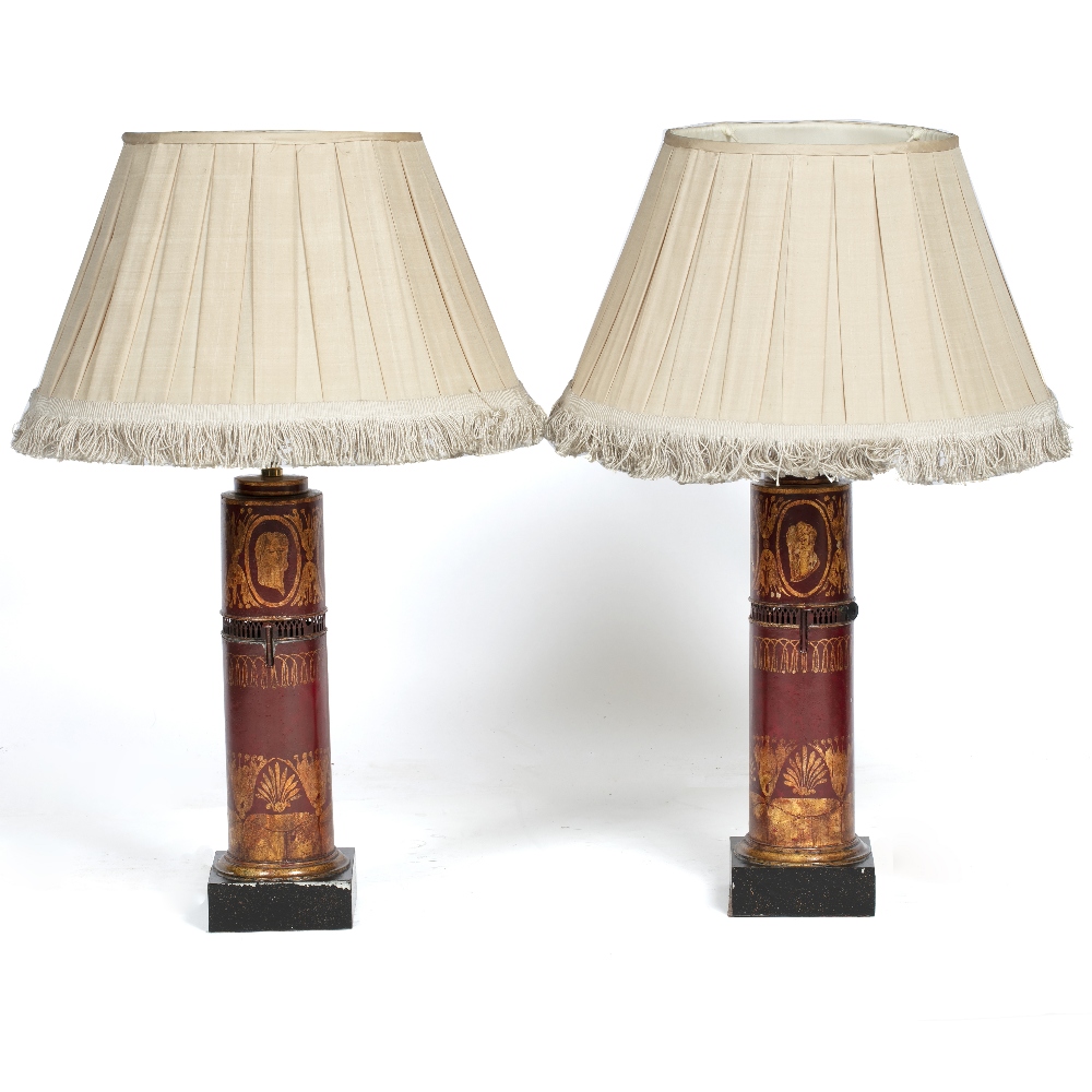 A PAIR OF 19TH CENTURY FRENCH TOLEWARE TABLE LAMPS with a gold painted decoration on a red ground,