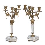 A PAIR OF MARBLE AND ORMOLU FOUR LIGHT THREE BRANCH CANDELABRA with tapering stems and serpentine