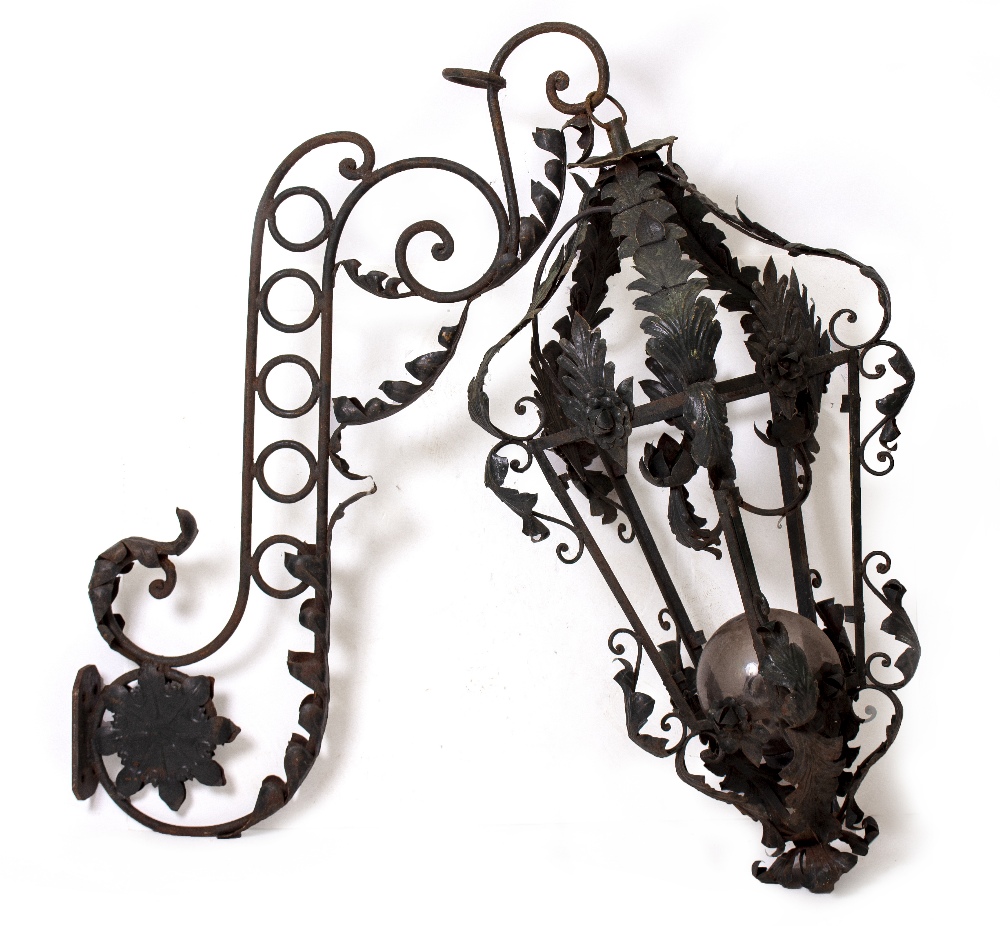 A PAIR OF LARGE WROUGHT IRON GREEN PAINTED LANTERNS with moulded leaf designs and each supported - Image 2 of 2