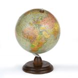 A CONTINENTAL TERRESTRIAL GLOBE 20cm diameter on a turned wooden stand, the globe and stand 29cm