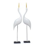 MICHAEL LYTHGOE (b.1950) a pair of Egrets, painted carved wood mounted on a slate base, signed