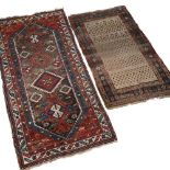 A LATE 19TH / EARLY 20TH CENTURY CAUCASIAN POLYCHROME RUG with a multiple banded border and