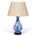 A TABLE LAMP in the form of a Chinese blue and white pear shaped vase with flaring rim and wooden