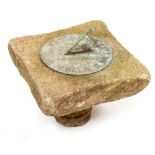 A MID TO LATE 20TH CENTURY SUN DIAL mounted on a composite stone block, 18cm diameter