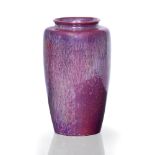 A MOTTLED PURPLE LUSTREWARE RUSKIN VASE of shouldered form and roll rim neck, circa 1910, 22cm in