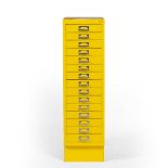 A YELLOW PAINTED FIFTEEN DRAWER NARROW FILING CABINET 28cm wide x 40.5cm deep x 98cm high