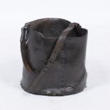 A 19TH CENTURY RIVETED LEATHER BUCKET with wooden base and loop handle, 28cm diameter x 32cm high