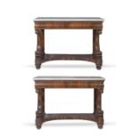 A PAIR OF 19TH CENTURY WALNUT MARBLE TOPPED CONSOLE TABLES with carved dolphin supports and platform