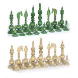 AN INDIAN 'PEPYS' PATTERN IVORY CHESS SET one half stained green, the Kings 14.5cm high (some