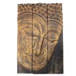 AN EASTERN GILDED WOODEN PLAQUE depicting a Buddha, in three parts, all together 60cm x 91cm