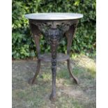 A VICTORIAN CAST IRON PUB TABLE decorated with masks and shaped legs united by an undertier and