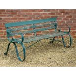 A GREEN PAINTED GARDEN BENCH with wrought iron ends and wooden slats, 161cm wide x 75cm high