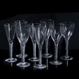 A GROUP OF FOURTEEN HANDMADE LARGE WINE GLASSES with ogee bowls and air twist stems, each