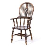 A LATE 19TH / EARLY 20TH CENTURY ASH AND ELM WINDSOR ARMCHAIR the arching back with shaped splat,