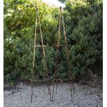 A PAIR OF WROUGHT IRON PYRAMIDAL GARDEN OBELISKS each surmounted by a ball finial, 49.5cm diameter x