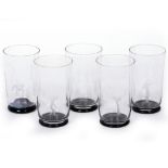 A SET OF FIVE ORREFORS DRINKING GLASSES four with a different engraved decoration and a black