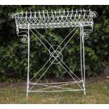 A VICTORIAN PAINTED WIREWORK PLANT STAND the top with scrolling edges, 92cm wide x 31cm deep x