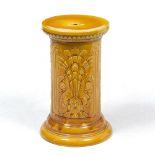 A VICTORIAN HONEY YELLOW GLAZED CYLINDRICAL STAND with stylised foliate decoration, 28cm diameter