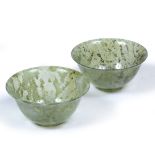 TWO SIMILAR GREEN TURNED HARDSTONE BOWLS each 10cm diameter x 5cm high