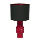 A WEST GERMAN RED GLAZED MODERNIST TABLE LAMP with central square section, 20cm wide, the lamp and