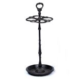 A 19TH CENTURY FRENCH CAST IRON STICK STAND with central handle and entwined snakes to the top of