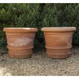 A PAIR OF LARGE TERRACOTTA RING TURNED FLOWER POTS OR PLANTERS 72cm diameter x 60cm high