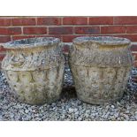 A PAIR OF RECONSTITUTED STONE GARDEN PLANTERS with intertwined knotted decoration, 40cm wide x